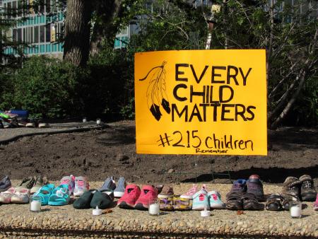 215 Children's shoes were placed in remembrance of the children's remains found in Kamloops